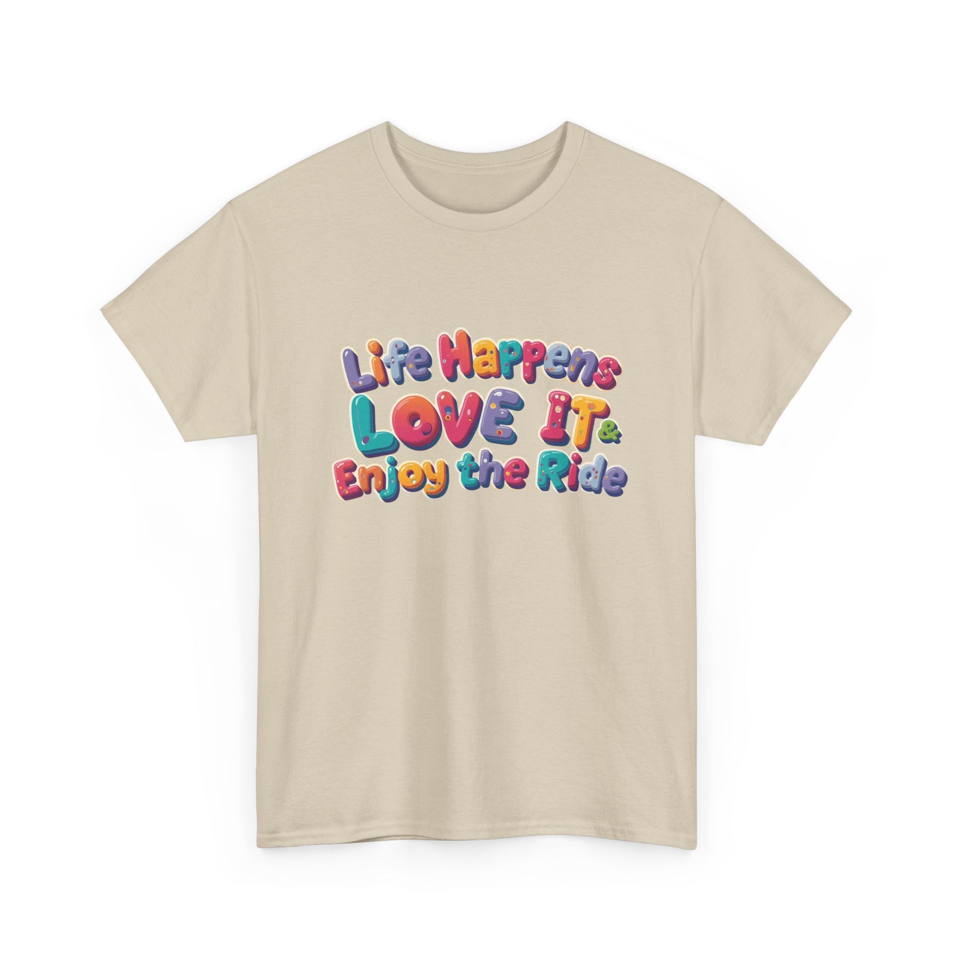 Life Happens Love It Enjoy the Ride Tee featuring colorful graphic text on a beige t-shirt.